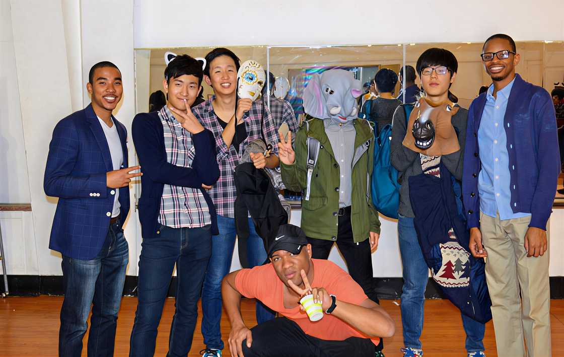 A grough of South Koreans and international young men posing for a photo A grough of South Koreans and international young men posing for a photo