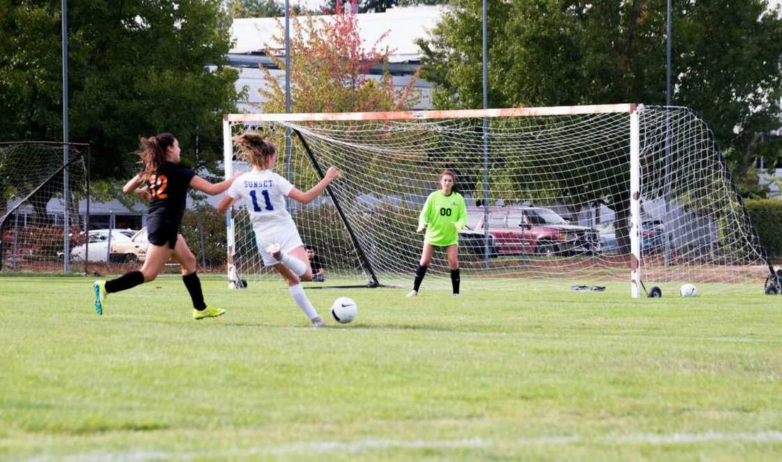 A group of female athletes playing football