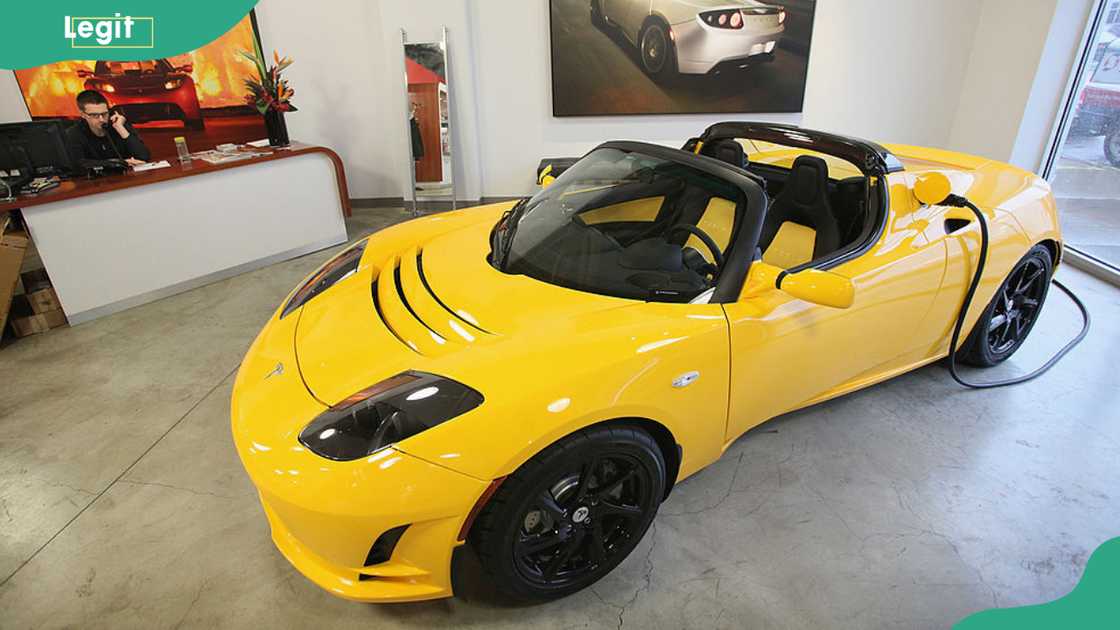 A Tesla Roadster Sport sits in a dealership showroom in Chicago, Illinois. Tesla Motors Inc