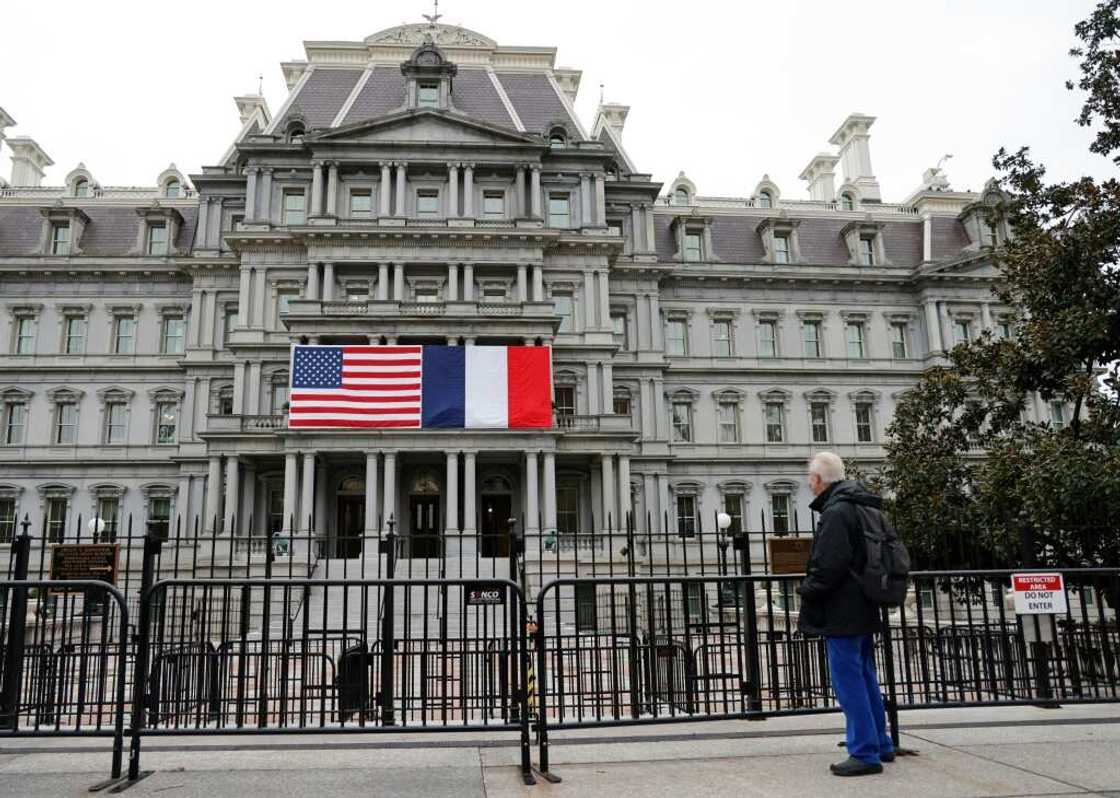 French and US flags adorn the Eisenhower Executive Office Building next to the White House for the state visit of French President Emmanuel Macron who arrives in Washington on November 29, 2022 French and US flags adorn the Eisenhower Executive Office Building next to the White House for the state visit of French President Emmanuel Macron who arrives in Washington on November 29, 2022