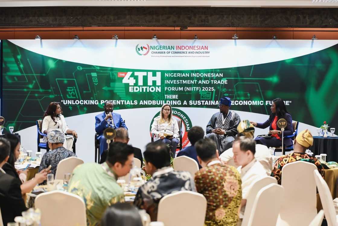 Investment bankers participate in a panel discussion. Investment bankers participate in a panel discussion.