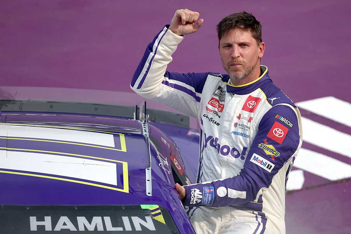 Denny Hamlin celebrates after winning the NASCAR Cup Series FireKeepers Casino 400 Denny Hamlin celebrates after winning the NASCAR Cup Series FireKeepers Casino 400