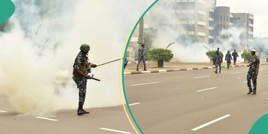  Woman collapses as police fire tear gas at Abuja protesters