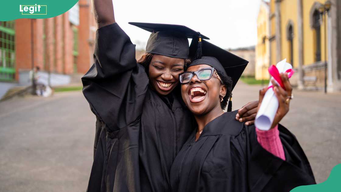 Female graduates celebrating academic achievement.
