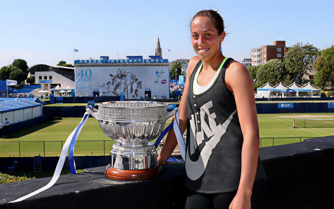 Madison Keys poses outdoors with the Aegon International trophy