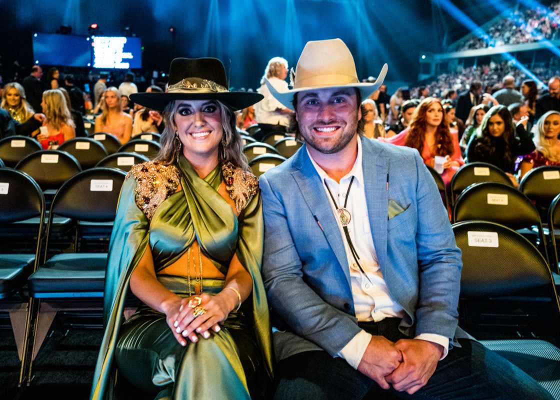 Lainey Wilson and Devlin Hodges seated at the 58th Academy of Country Music Awards