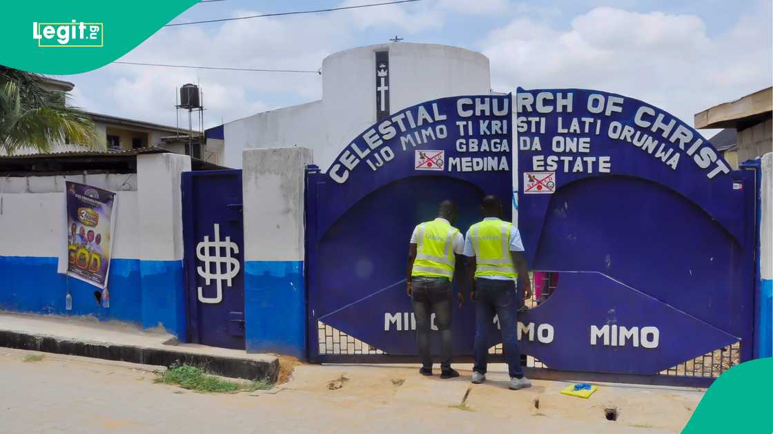 LASEPA officials standing in front of the gate of Celestial Church of Christ at Gbagada One, Medina Estate