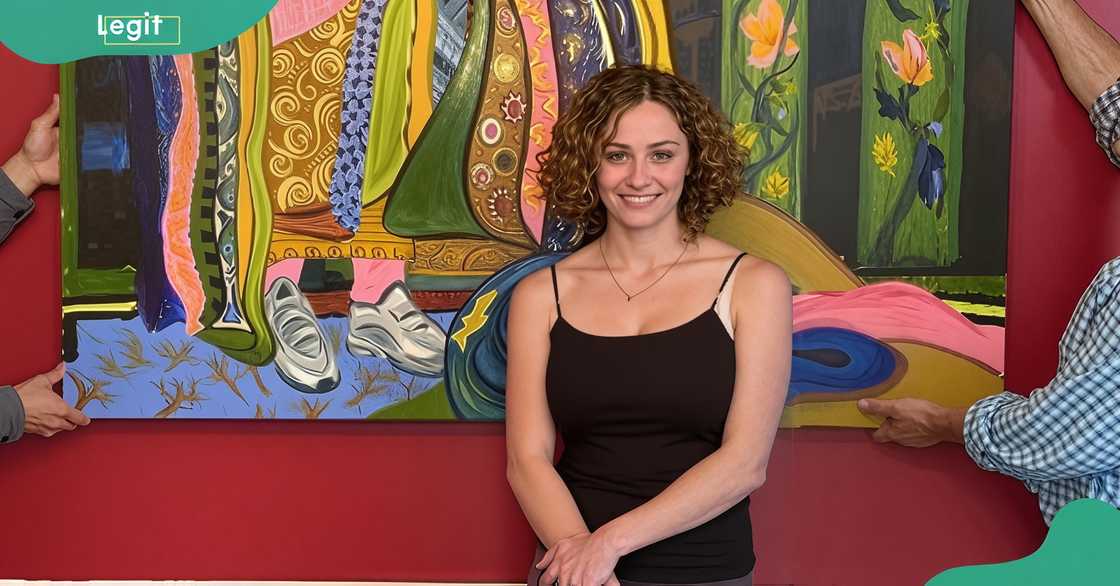 Stella Street Guggenheim poses in front of her painting
