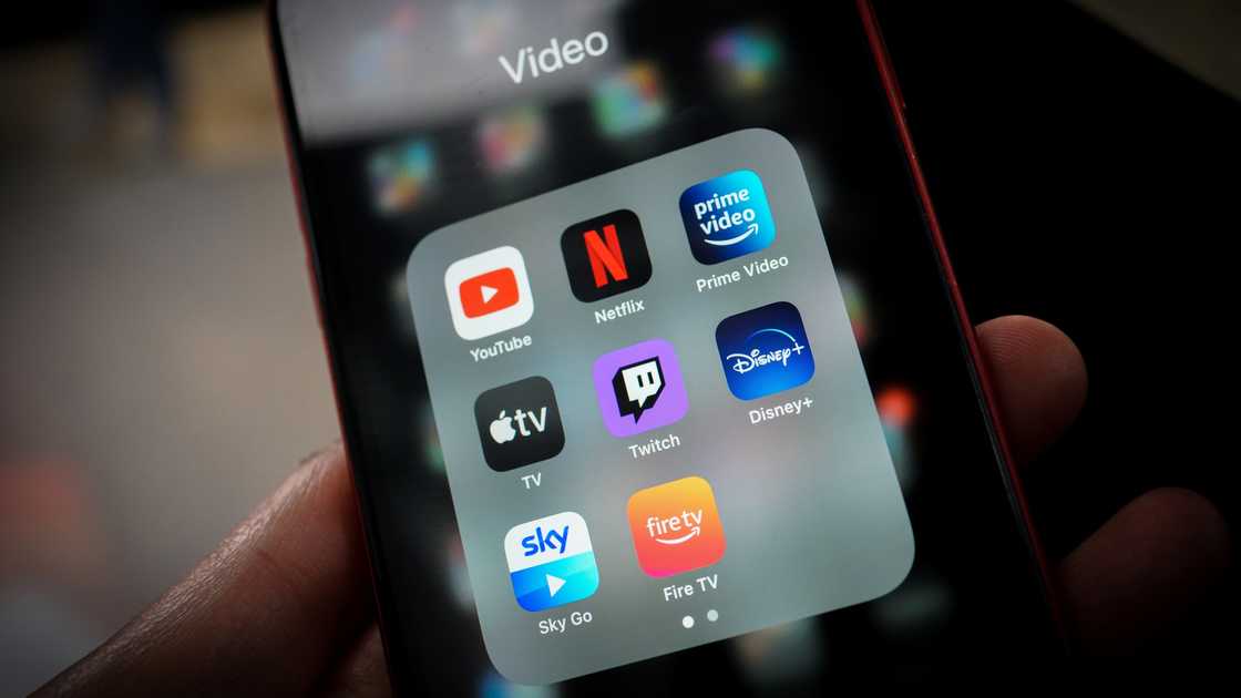 A smartphone with different apps including Netflix. A smartphone with different apps including Netflix.