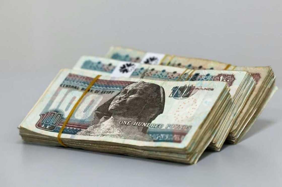 Egyptian pound plunged to a record low of around 50 to the US dollar Egyptian pound plunged to a record low of around 50 to the US dollar