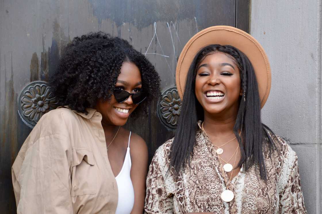 Two best friends are smiling