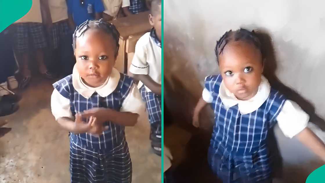 A little girl trends for answer questions in class.