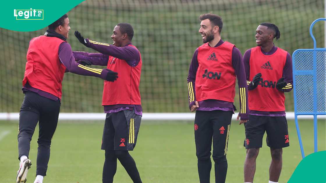 Odion Ighalo celebrates with Mason Greenwood during a Manchester United training