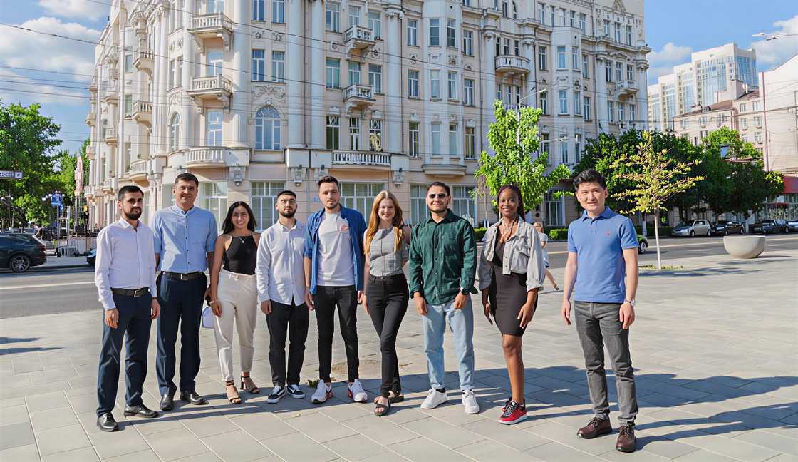 A group of students pose in front of the main building of Southern Federal University in Rostov-on-Don, Russia