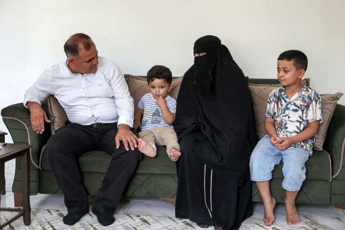 Moatassem Abdel Sater, a 42-year-old former inmate at Sednaya prison, with his wife Bara'ah and their children Othman, on the left, and Abdel Sattar Moatassem Abdel Sater, a 42-year-old former inmate at Sednaya prison, with his wife Bara'ah and their children Othman, on the left, and Abdel Sattar