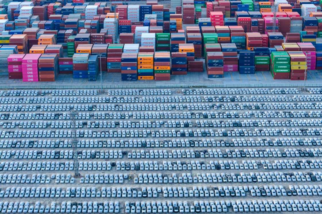 An aerial view of vehicles awaiting their export at a port in Nanjing, eastern China's Jiangsu province on December 9, 2025 An aerial view of vehicles awaiting their export at a port in Nanjing, eastern China's Jiangsu province on December 9, 2025
