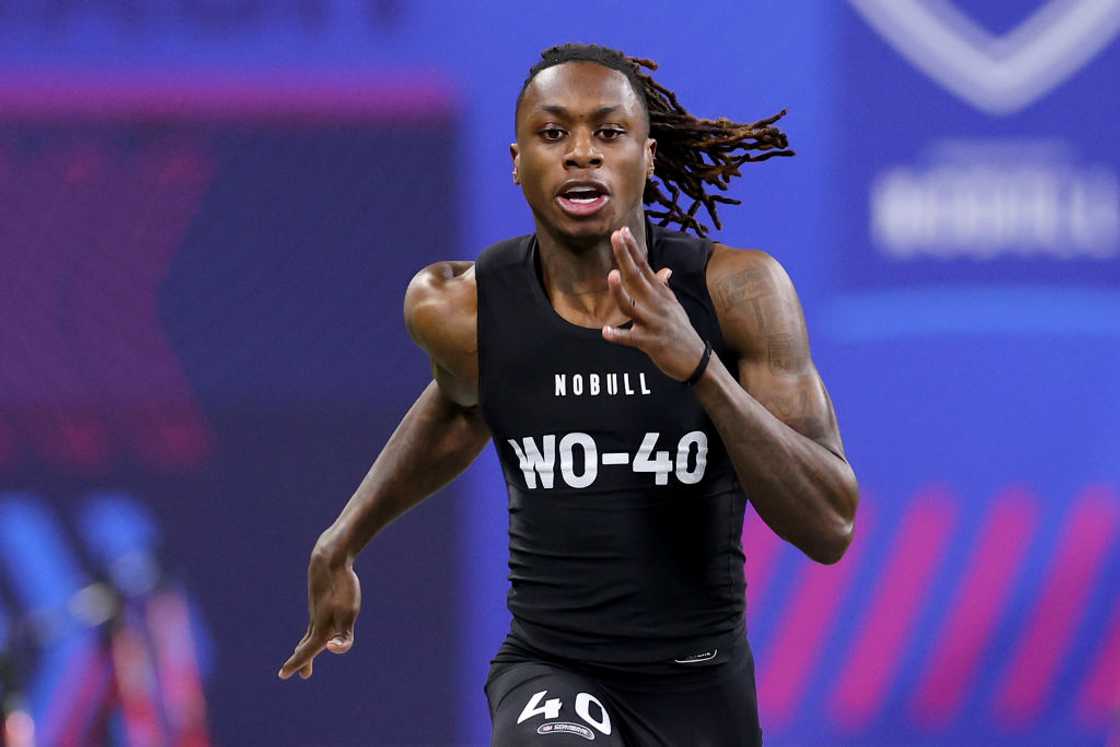 Xavier Worthy participates in the 40-yard dash during the NFL Combine at Lucas Oil Stadium