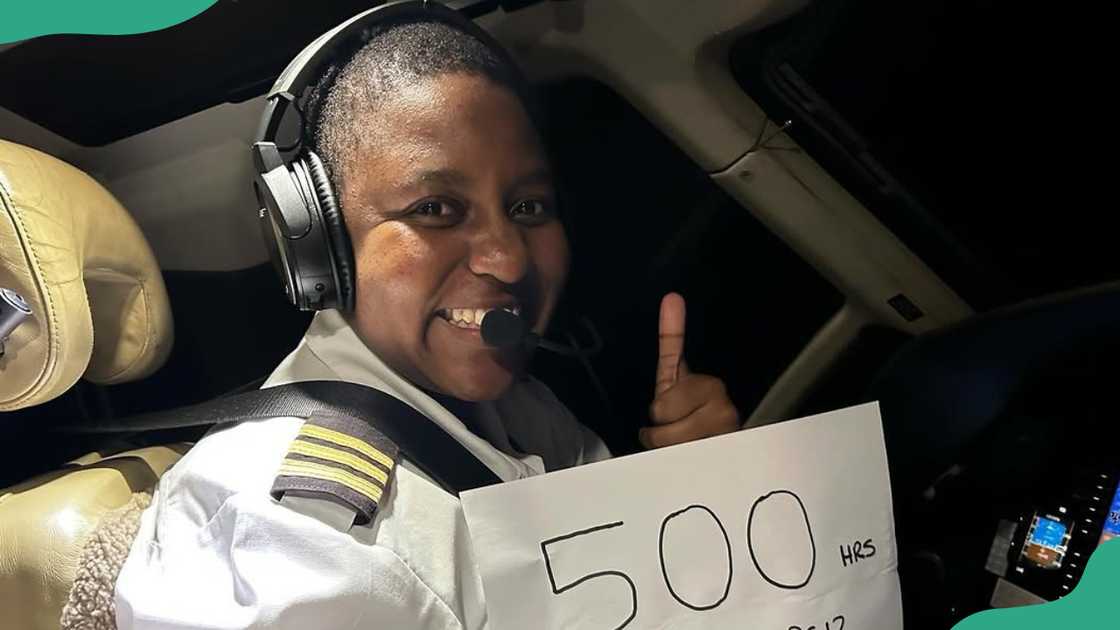 A pilot smiles as she celebrates a flight hours milestone A pilot smiles as she celebrates a flight hours milestone