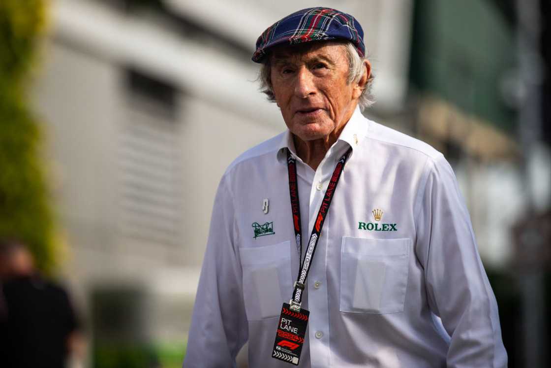 Sir Jackie Stewart walks in the paddock in Singapore