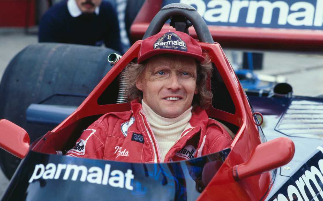 Niki Lauda, shown in his race car in pits. Niki Lauda, shown in his race car in pits.