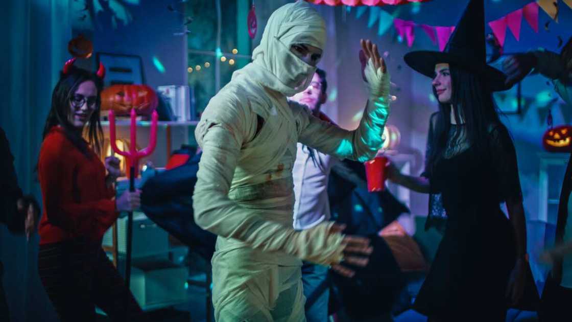 Scary Halloween themes: Old skinny and bandaged mummy dances Scary Halloween themes: Old skinny and bandaged mummy dances