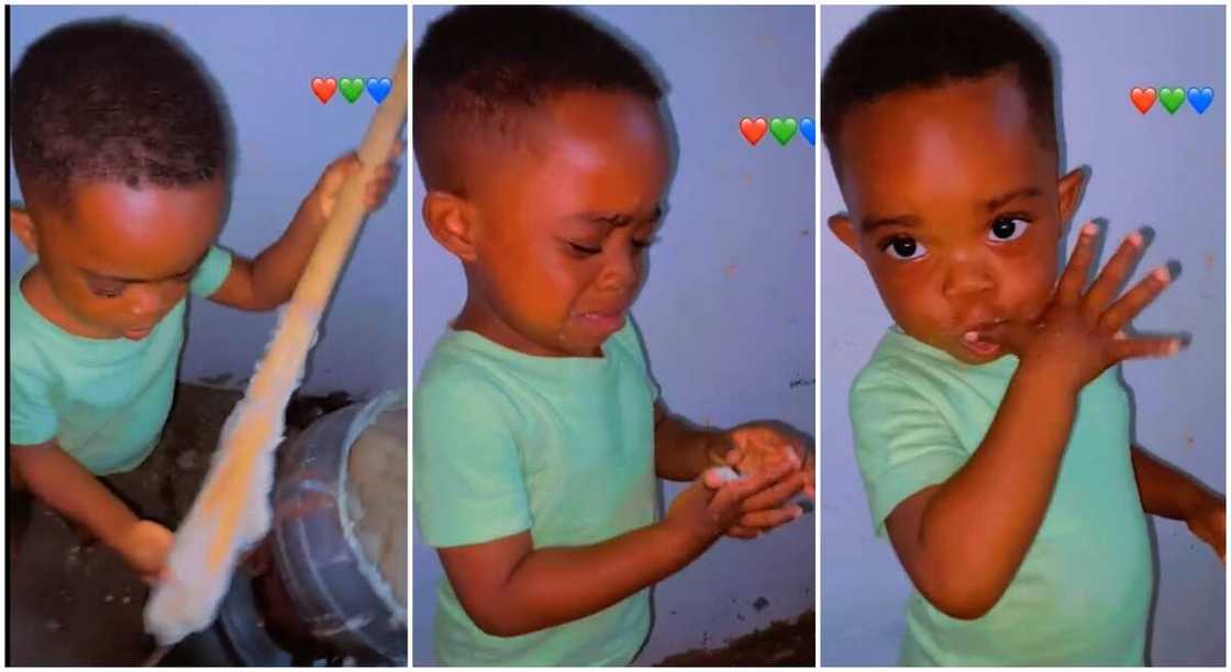 Photos of a boy holding 'turning garri stick'. Photos of a boy holding 'turning garri stick'.