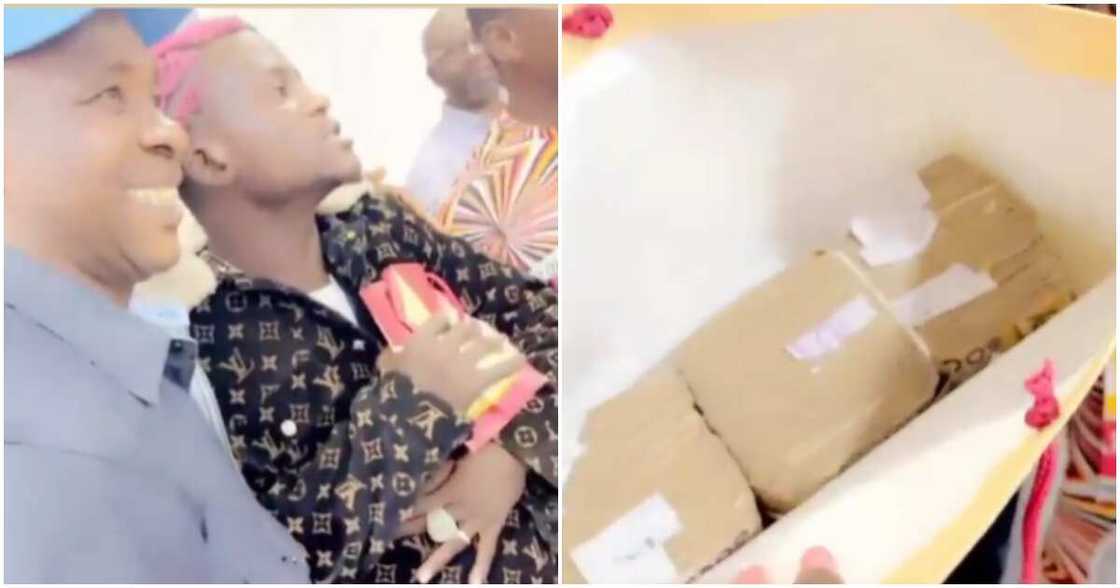 Nigerian singer Portable holding bag of money from governor Oyetola