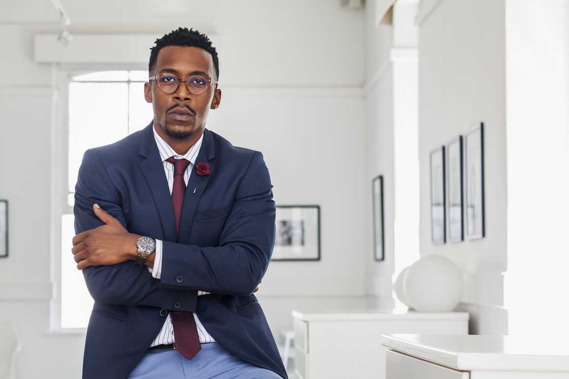 A sad man talking, arms crossed