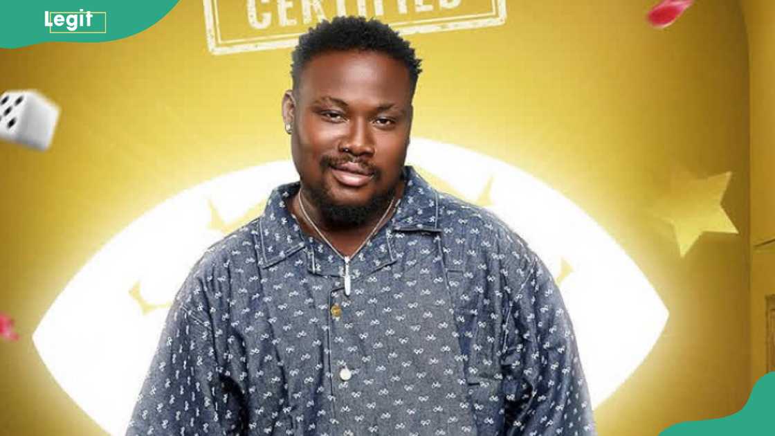 Rooboy BBNaija posing in a black-white shirt