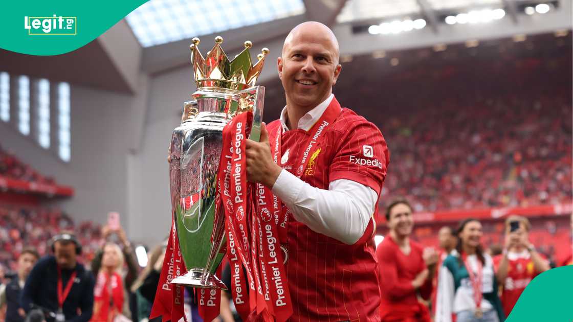 Arne Slot celebrates with the Premier League trophy. Photo by Carl Recine