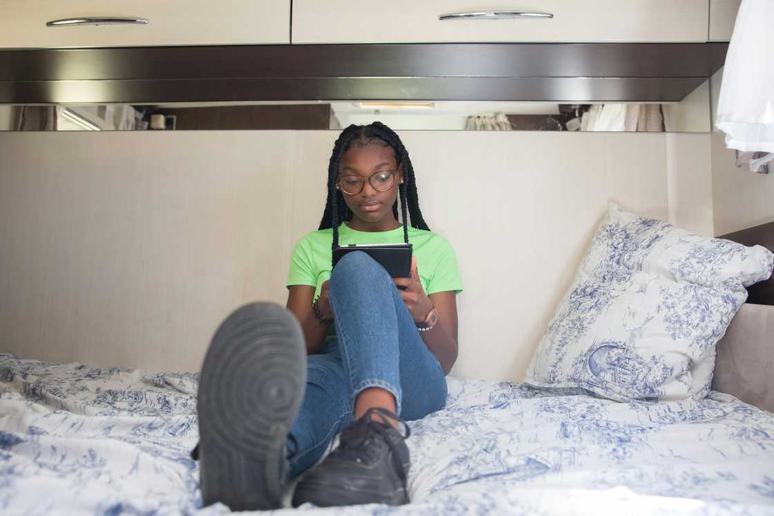 A girl reading a journal