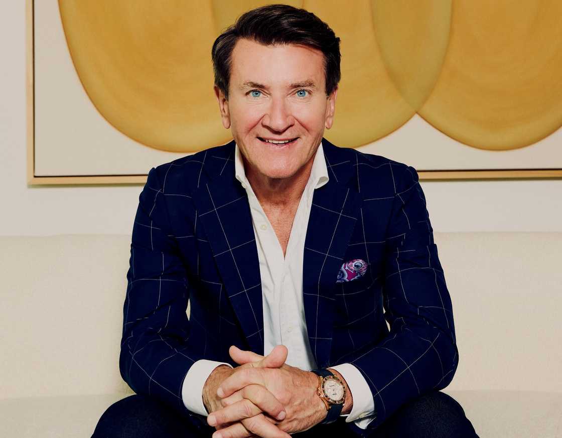 Robert Herjavec poses sitting in a promo shoot. Robert Herjavec poses sitting in a promo shoot.