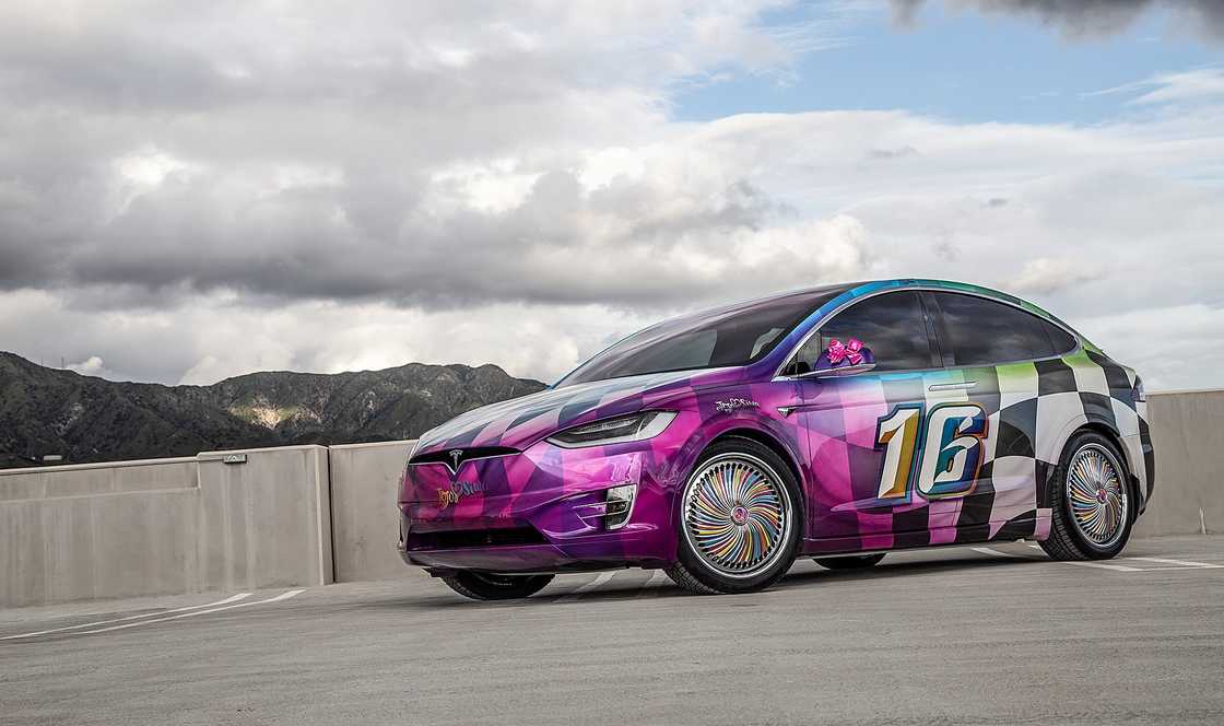 A custom wrapped Tesla Model X with racing elements. A custom wrapped Tesla Model X with racing elements.