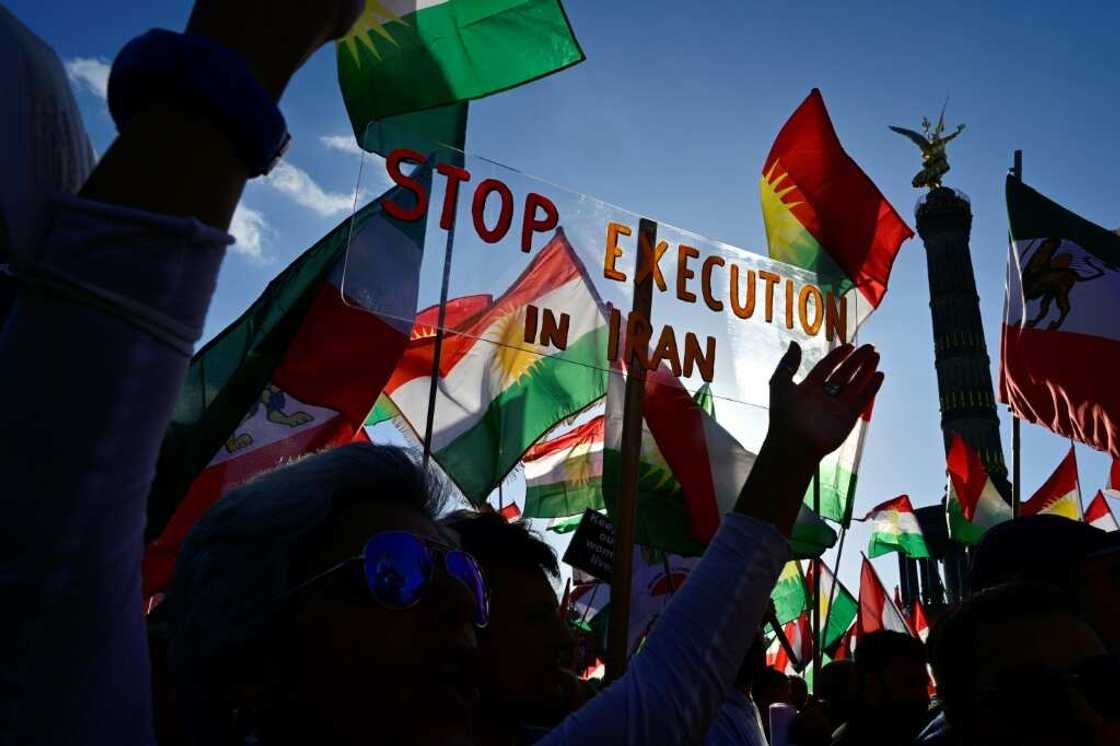 Protesters in Berlin hold up a banner reading 'Stop Execution in Iran' Protesters in Berlin hold up a banner reading 'Stop Execution in Iran'