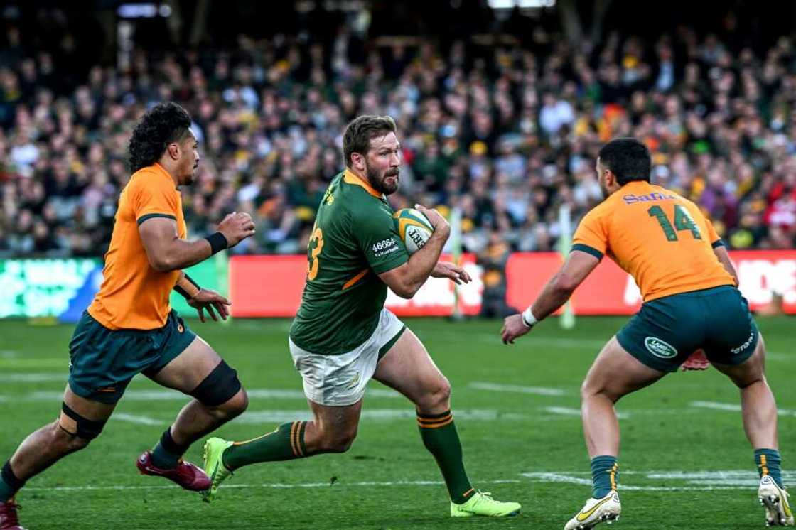 South African Francois Steyn (C) evades two Australians during a 2022 Rugby Championship match in Adelaide South African Francois Steyn (C) evades two Australians during a 2022 Rugby Championship match in Adelaide