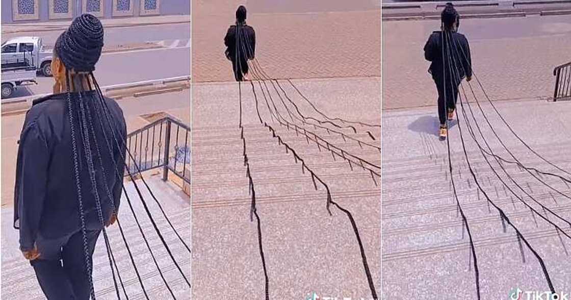 Lady sweeps floor with long braids, extremely long Lady sweeps floor with long braids, extremely long