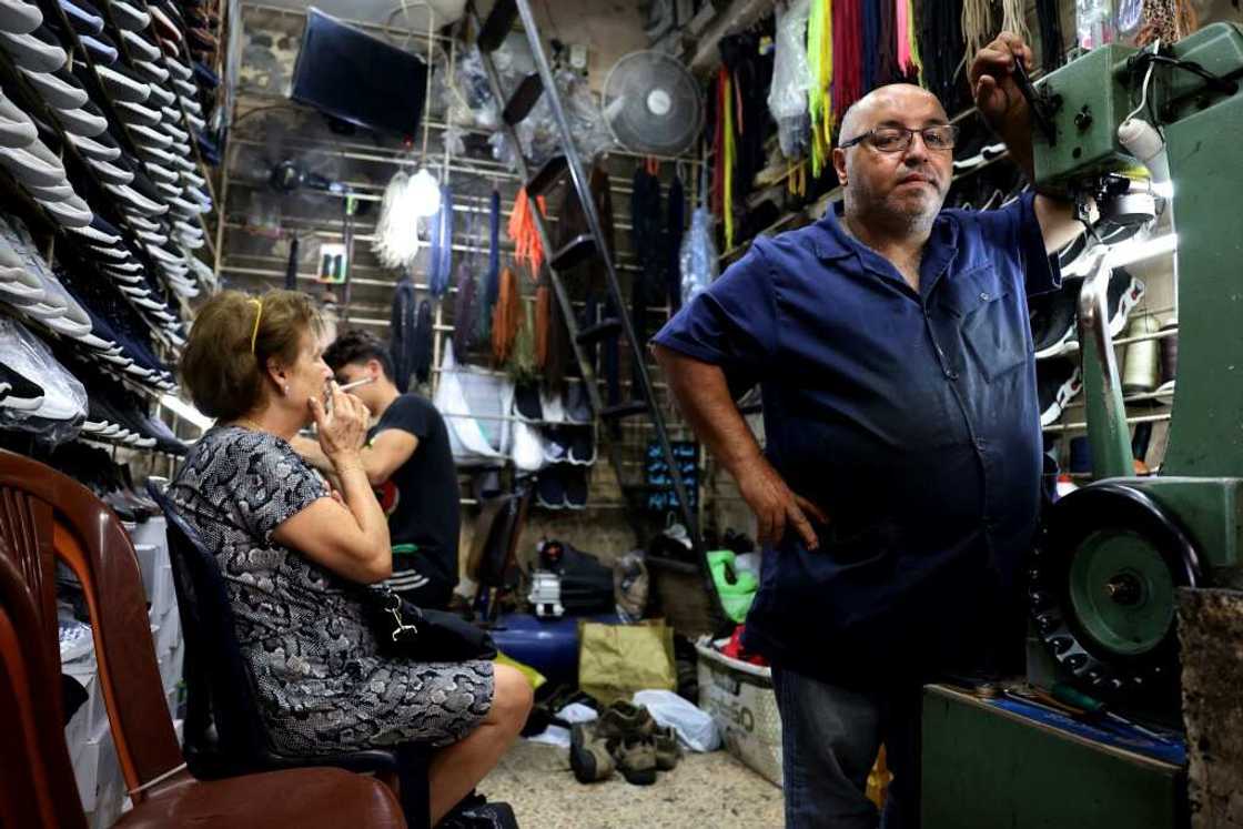 Ahmed al-Bizri's shoe repair store is nestled among old stone arches and a crowded warren of shops and stalls in Sidon Ahmed al-Bizri's shoe repair store is nestled among old stone arches and a crowded warren of shops and stalls in Sidon