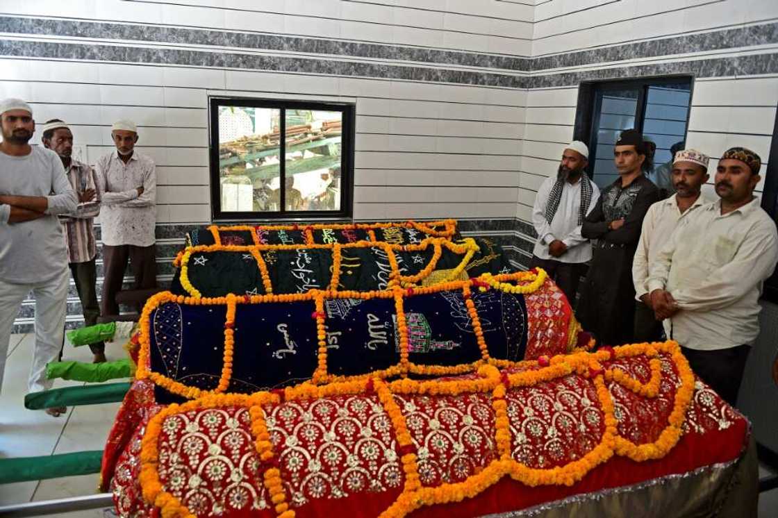 Hundreds of mourners milled among the rows of graves at the Muslim cemetery in Morbi on Monday, a day after more than 130 people were killed in the bridge collapse Hundreds of mourners milled among the rows of graves at the Muslim cemetery in Morbi on Monday, a day after more than 130 people were killed in the bridge collapse