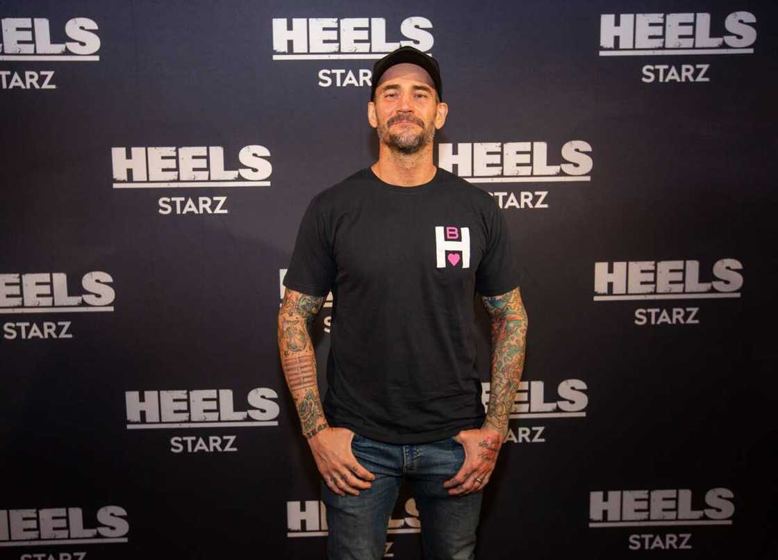 CM Punk pose for a photo during a screening episode of the Heels CM Punk pose for a photo during a screening episode of the Heels