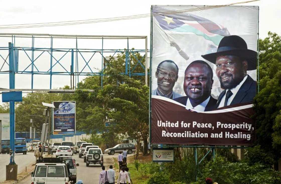 April 2016: Machar, centre, and Kiir, right, send a message of unity