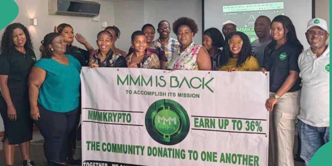 Photo of people promoting MMM.