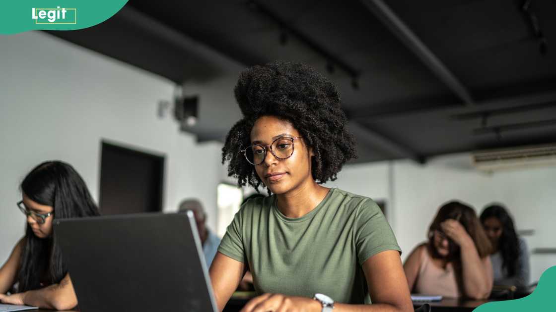 Student using a laptop in the classroom. Student using a laptop in the classroom.