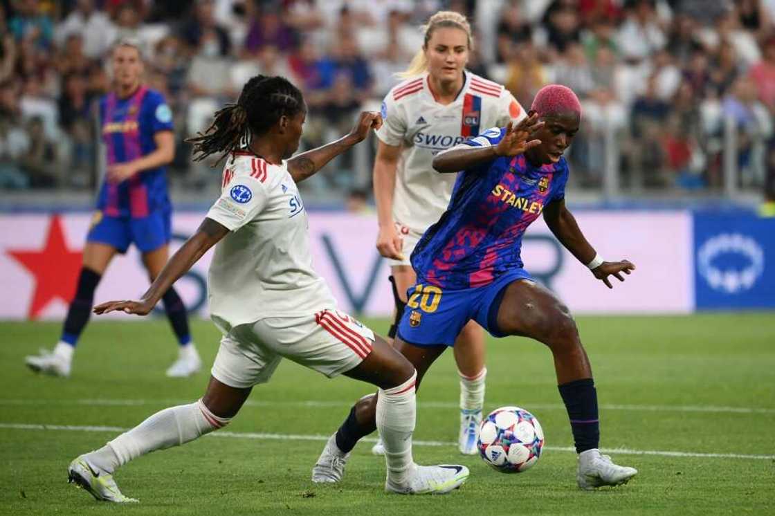 Nigeria star Asisat Oshoala (R) playing for Barcelona against Lyon in the Women's European Champions League final in Turin on May 21, 2022. Nigeria star Asisat Oshoala (R) playing for Barcelona against Lyon in the Women's European Champions League final in Turin on May 21, 2022.