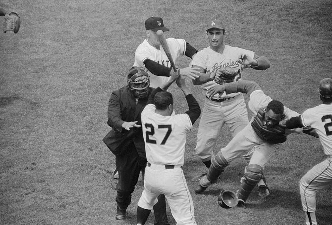 Los Angeles Dodgers' catcher John Roseboro fight with San Francisco Giant pitcher Juan Marichal. Los Angeles Dodgers' catcher John Roseboro fight with San Francisco Giant pitcher Juan Marichal.