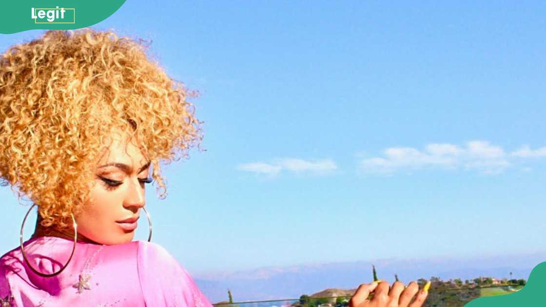 Kayja Rose in an outdoor setting on a bright, sunny day