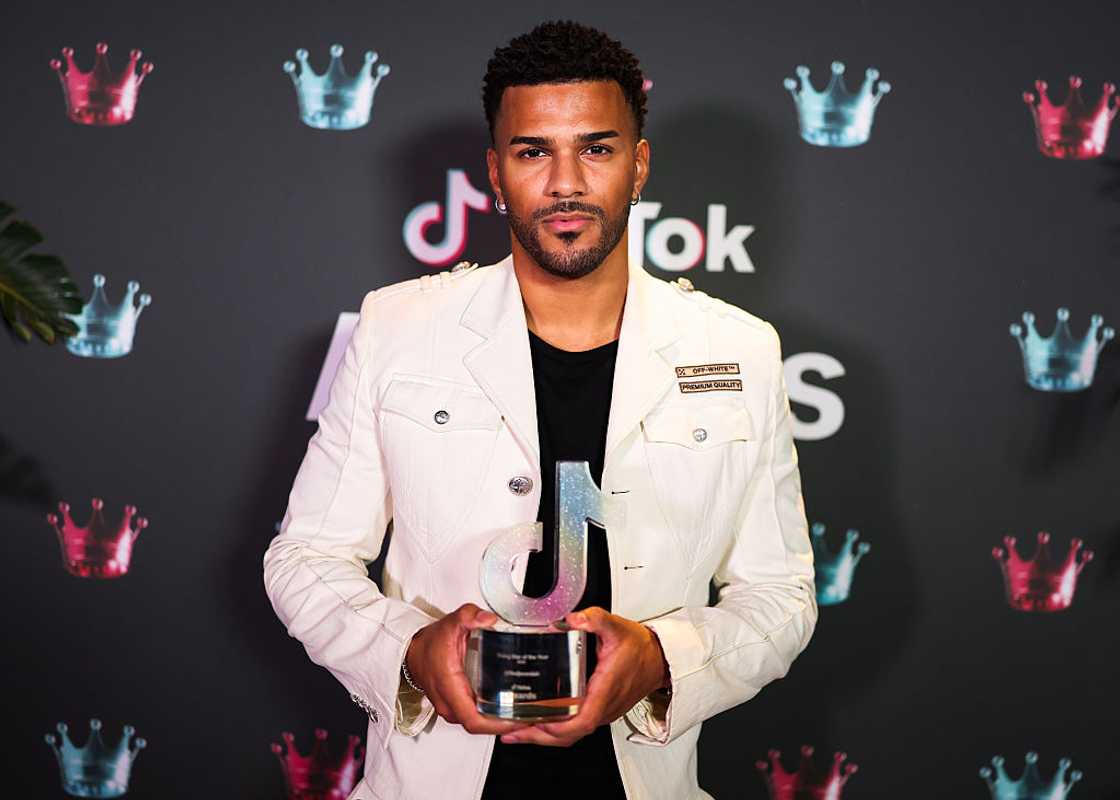 TV personality Jeremiah Brown holding an award