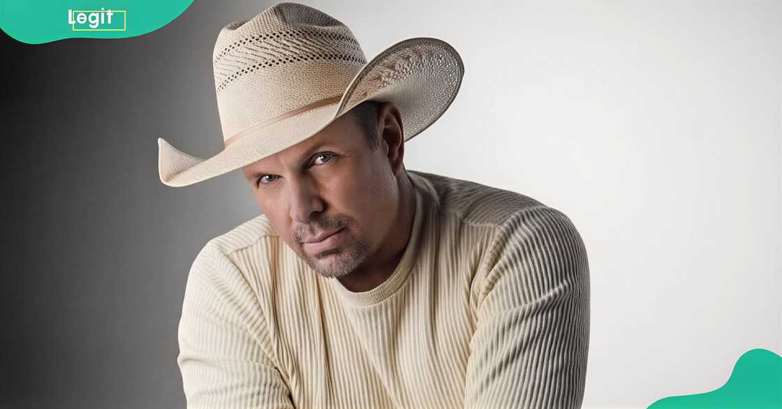 Garth Brooks poses sitting for promotional material for his studio album