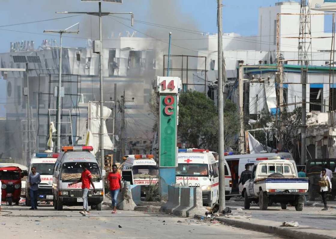 The deadly explosions shattered windows of nearby buildings, sent shrapnel flying and clouds of smoke and dust into the air