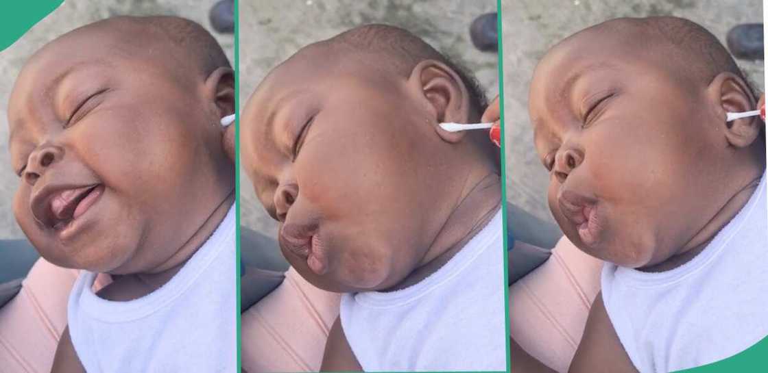 Baby laughs as his ear was tickled. Baby laughs as his ear was tickled.