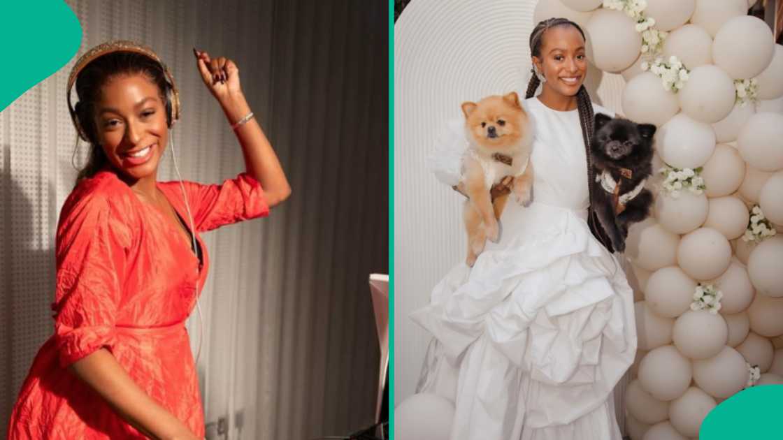 DJ Cuppy poses with her dogs after her baptism.